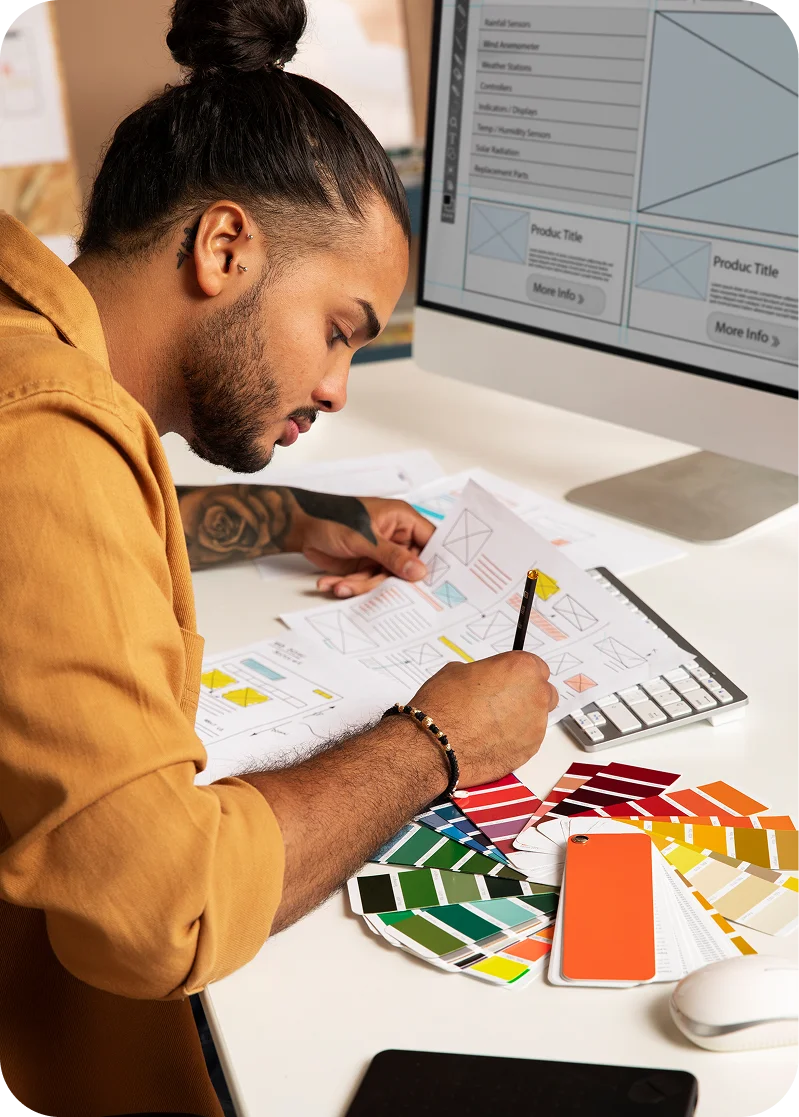 Web designer working on a website layout, focusing on UI/UX design.